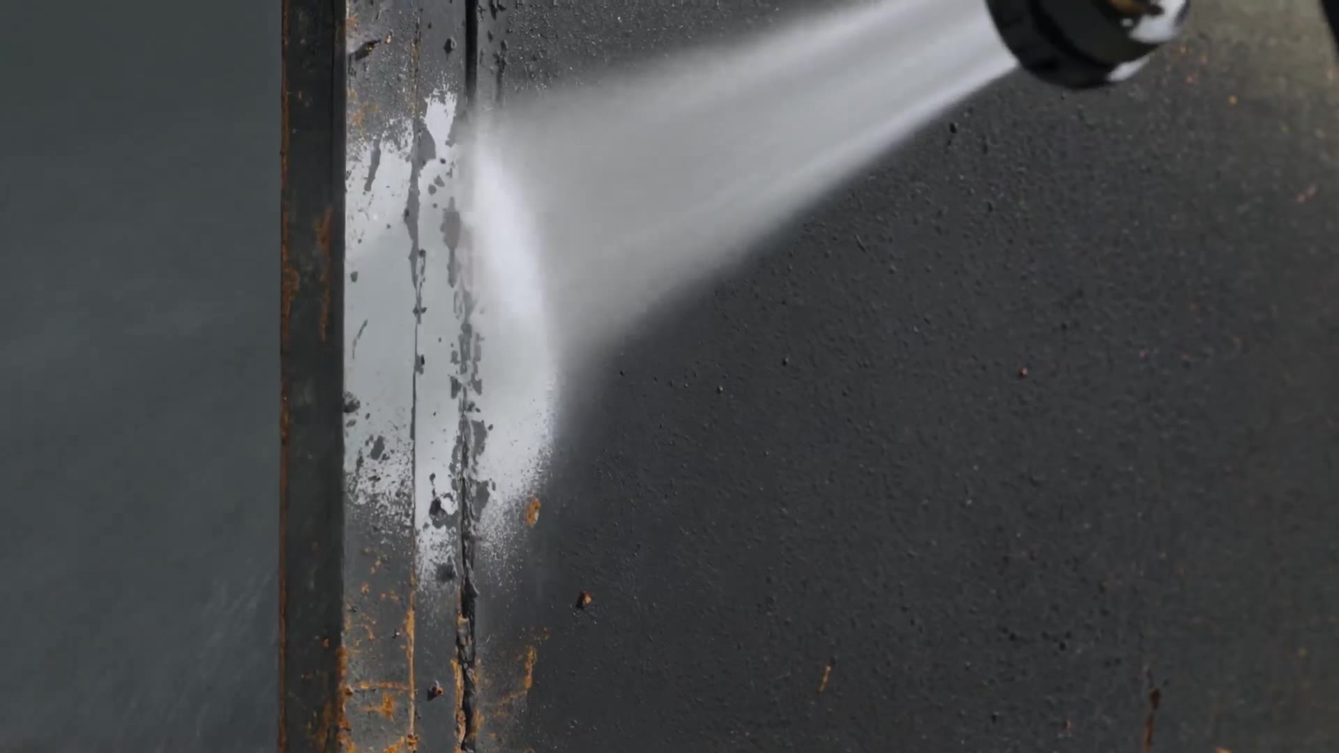 Dry ice blasting soot from charred structural steel